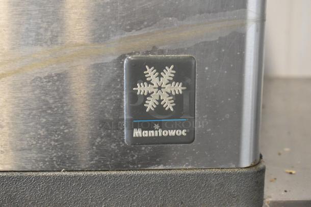 Manitowoc QD0452A stainless steel commercial ice head with Ice O Matic bin, visible brand logo, 115V, 1 phase, on casters.