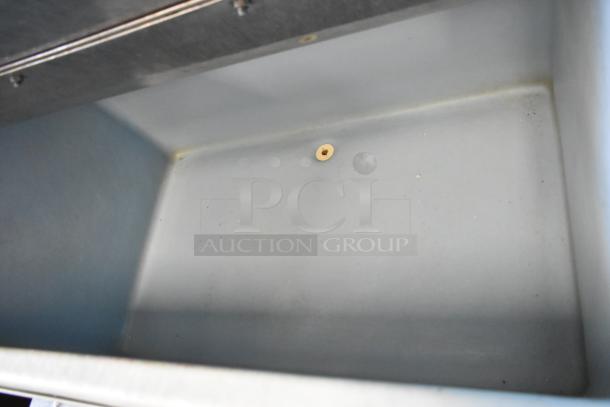 Manitowoc QD0452A ice head on Ice O Matic bin with commercial casters. Stainless steel. 115 volts, 1 phase.
