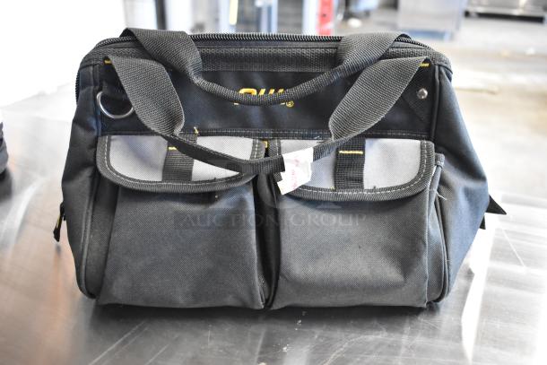 Black tool bag with dual front pockets, sturdy handles, and visible “CRAFT” branding. Tag attached. Includes contents.