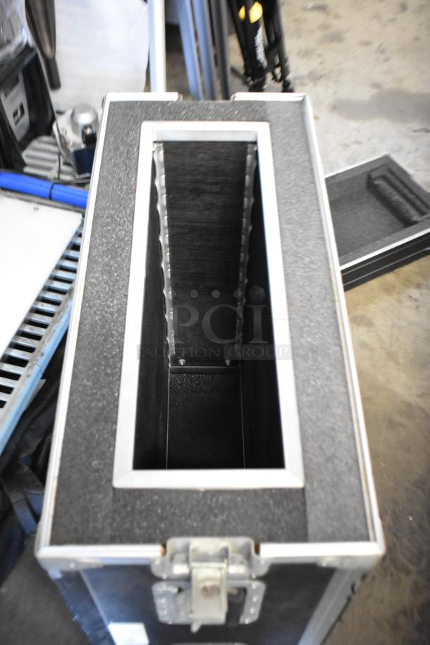 Industrial equipment case with interior foam padding, metal frame, and secure latch. Suitable for protecting electronic devices.