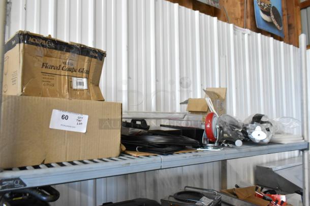 ALL ONE MONEY! Tier lot with commercial casters, flared coupe glass box, seals, and various items on a metal shelf.