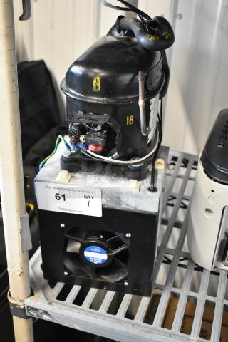 Baxter Mini K 1416 Compressor, black, 115 volts, 1 phase, features attached fan; auction tag visible, good condition.