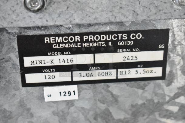 Baxter Mini K 1416 Compressor label showing model, serial number, 120 volts, 3.0A, 60Hz, R12 5.5 oz capacity.