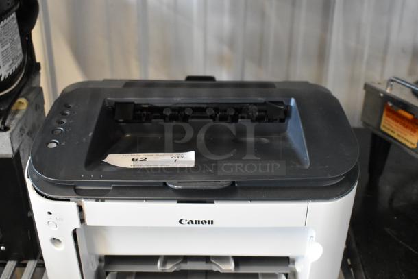 Canon F166500 Printer in good condition, black and white, top view showing control panel and paper tray, auction label visible.