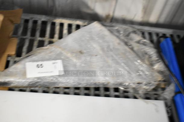 Stack of metal brackets wrapped in plastic, labeled with "65" and "QTY 11." They appear unused and in good condition.