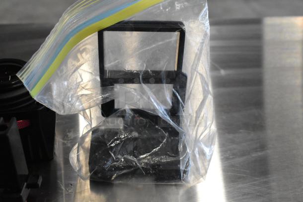 Two boxes contain Z Finder Pro Kit and clamps, partially visible in a clear plastic bag. Items are in good condition.