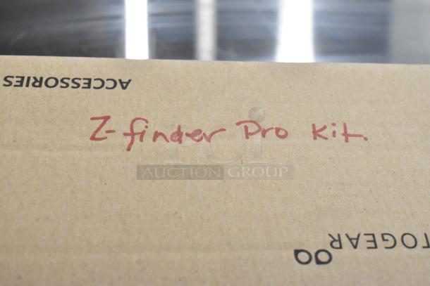 Cardboard box labeled "Z Finder Pro Kit," featuring clamps. Auction includes two boxes.