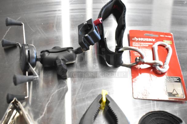 Z Finder Pro Kit with clamps and Husky 24-inch carabiner hang strap in original packaging on metal surface.