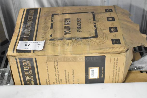 Box of new Skroam food storage containers; airtight, labeled "Your New Storage Set," slight box wear, includes auction label.