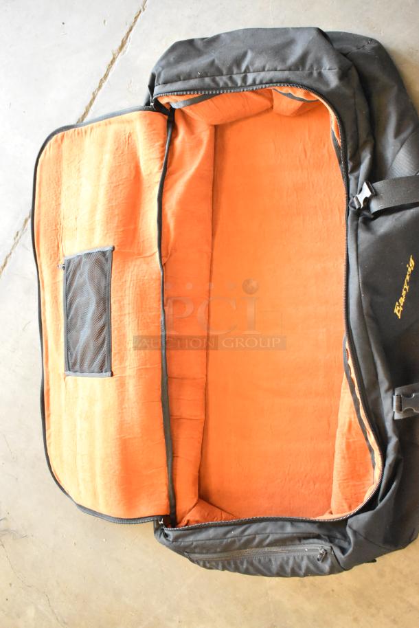 Easyrig black soft bag with bright orange interior, zipper pocket, and adjustable strap; in excellent condition.