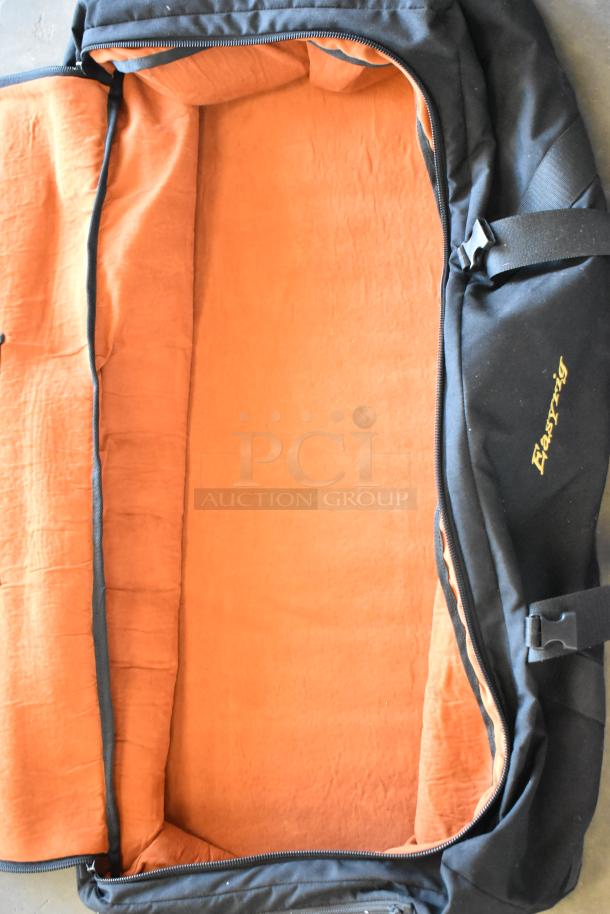 Easyrig black soft bag, open with orange lining, durable exterior, and visible Easyrig logo, in excellent condition.