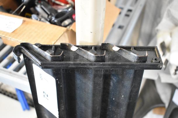 Black reach-in cooler vent cover, used condition, with visible mounting slots and identification label marked "72 qty."