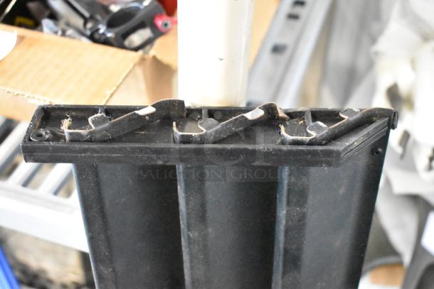 Black reach-in cooler vent cover, made of durable plastic, showing slight wear. Ideal for refrigeration repair.