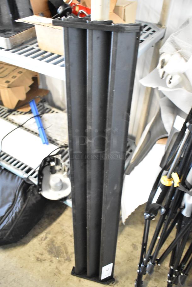 Black reach-in cooler vent cover, tall design, used condition, with visible tag indicating model or inventory number.