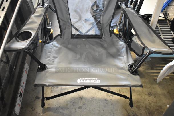 GCI Outdoor gray collapsible chair with armrests and cup holder, Comfort Pro Rocker model, in good condition.