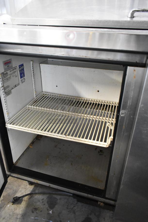True TSSU-48-12 stainless steel commercial sandwich prep table, open storage shown, 115 Volts, 1 Phase, moderate wear.