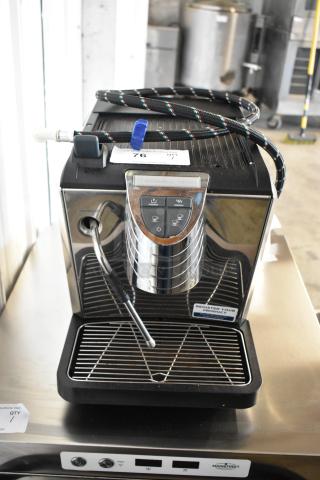 BRAND NEW SCRATCH AND DENT metal commercial countertop espresso machine with steam wand, visible power cord, and control panel.