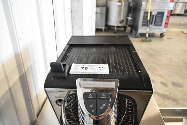 BRAND NEW SCRATCH AND DENT! Metal commercial espresso machine with steam wand by Simonelli, Model: Oscar II. Tags show auction info.