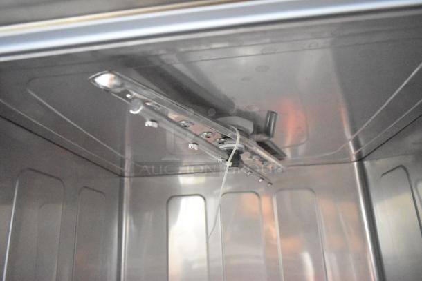 Interior view of a new Mainstreet 541HTUC30 stainless steel high-temp undercounter dishwasher. 208/240V, 1 phase.