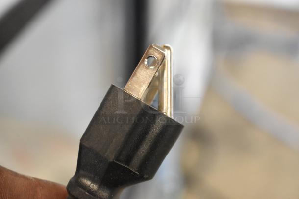 Close-up of a power plug from the Avantco 178DLC82HCS Refrigerated Deli Case. 115 Volts, 1 Phase connection.
