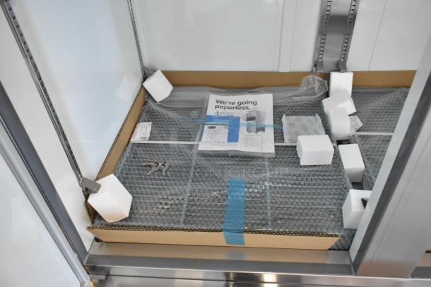 Brand new Avantco 178A49RHC stainless steel 2-door reach-in cooler, poly coated racks, casters, 115V, 1 Phase.
