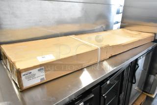 Boxed Carlisle 926007 60"x12.5" aluminum sneeze guard, scratch and dent, for Five Star Buffet Bars. Label visible.