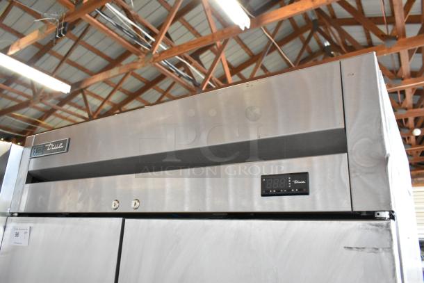 2017 True T-35-HC stainless steel commercial reach-in cooler, 2 doors, poly coated racks, on casters, 115V, pristine condition.