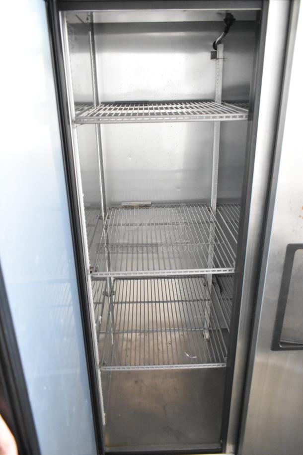 2017 True T-35-HC stainless steel 2-door reach-in cooler, poly coated racks, commercial casters, 115V, 1 phase.
