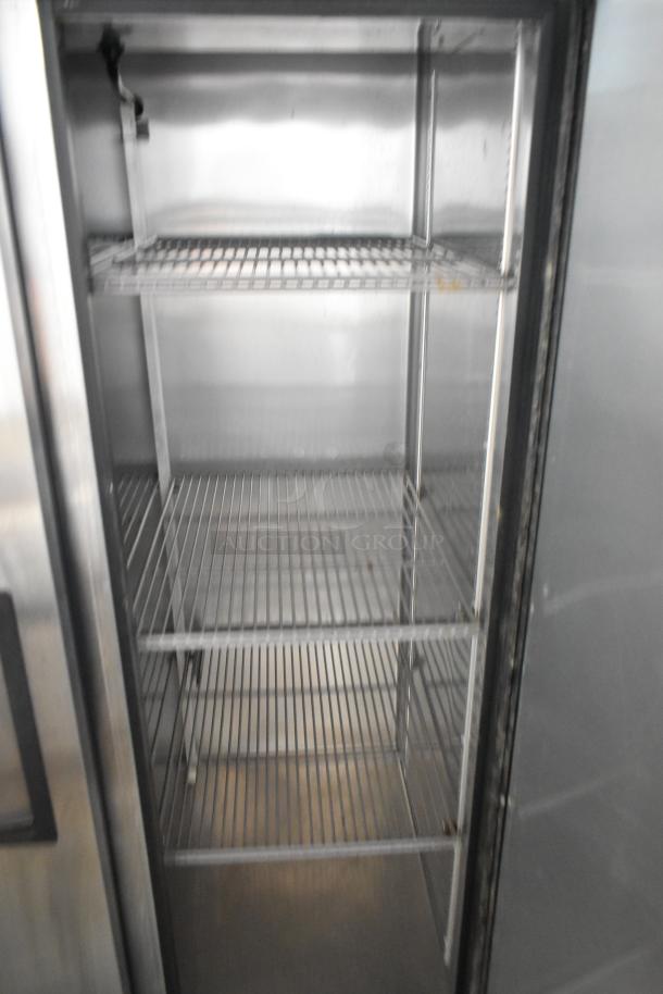 2017 True T-35-HC stainless steel 2-door reach-in cooler, poly-coated racks, commercial casters, 115V, 1 phase.