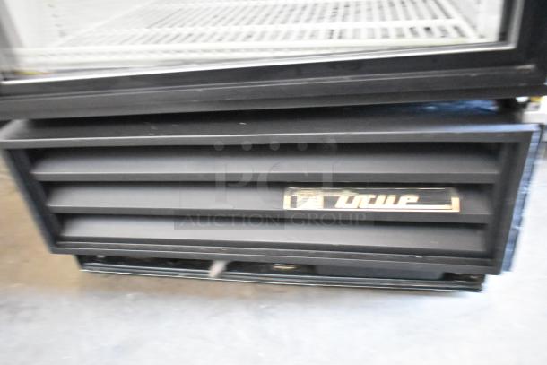 True GDM-12 Metal Commercial Reach-In Cooler, single door, poly coated racks, 115 volts, 1 phase, brand label visible.