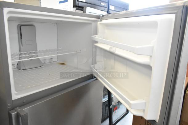 2022 Whirlpool WRT311FZDM05 stainless steel fridge-freezer. Interior view shows clean shelves. 115V, 1 Phase.