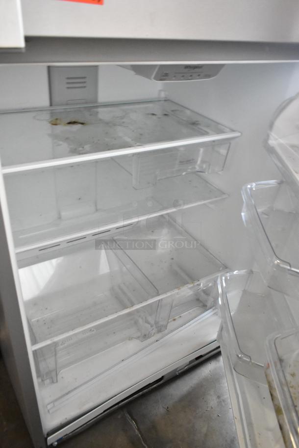 2022 Whirlpool WRT311FZDM05 stainless steel cooler with freezer, 115V, 1 phase. Interior shelves and bins visible, moderate wear.