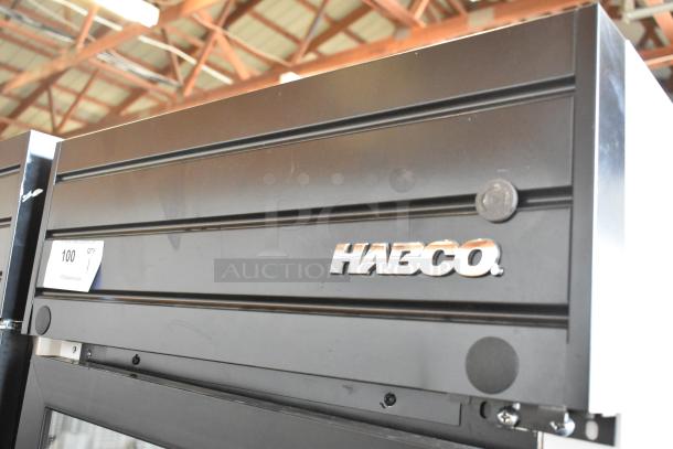 2019 Habco SE18 metal commercial cooler, single door, black, 115 volts, door needs reattachment, visible auction tag.