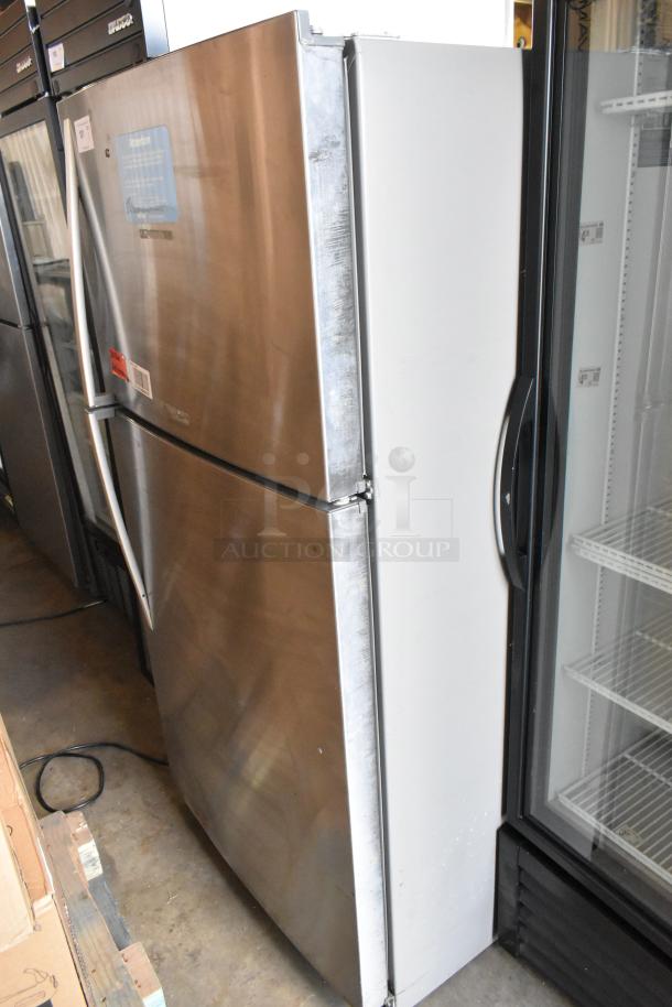 2016 Whirlpool WRT511SZDM00 Stainless Steel Refrigerator-Freezer, 115V, good condition, visible tags and markings.