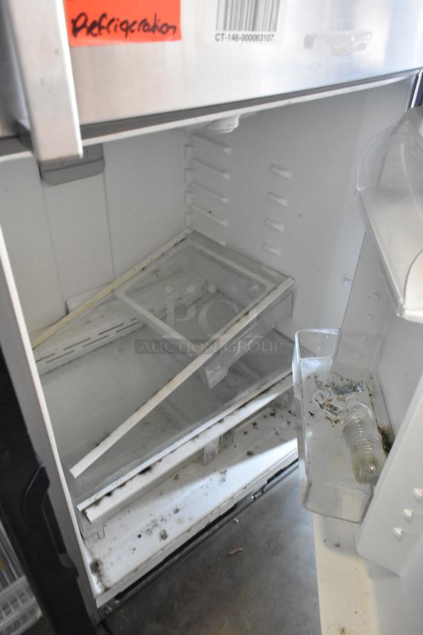 2016 Whirlpool WRT511SZDM00 stainless steel refrigerator with freezer, visible wear, 115 volts, 1 phase. Red "Refrigeration" label.