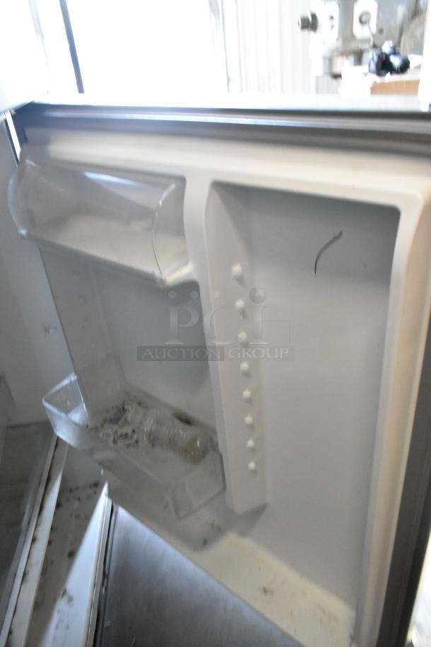 2016 Whirlpool WRT511SZDM00 stainless steel cooler with freezer, shown open. Interior shelves visible. 115V, 1 Phase.
