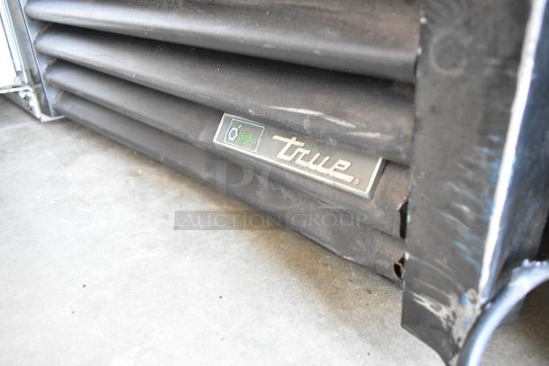 2019 True GDM-26-HC single door reach-in cooler, metal, with poly-coated racks. Visible "True" brand badge. 115V, 1 phase.