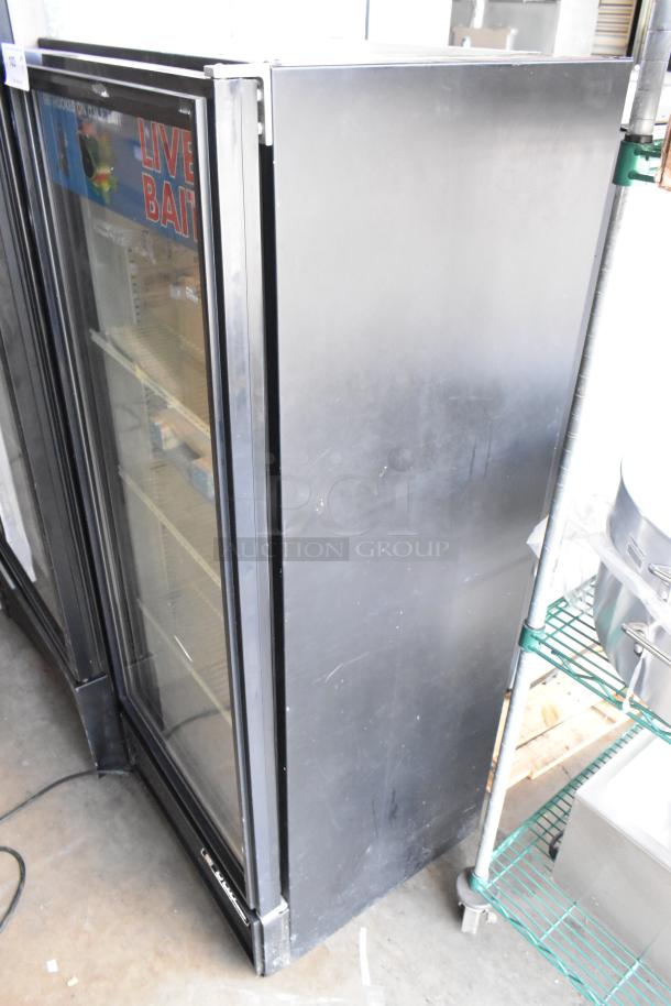 True GDM-12 single door cooler merchandiser, metal, with poly-coated racks, black exterior, 115V, 1 phase, used condition.