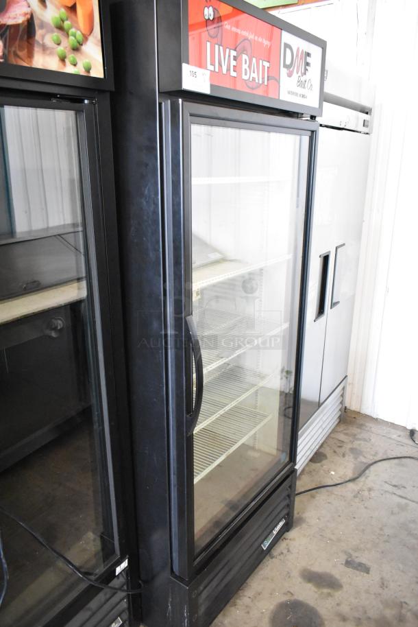 2020 True GDM-26-HC single door cooler, metal frame, poly-coated racks, 115V, 1 phase, with "Live Bait" sign.