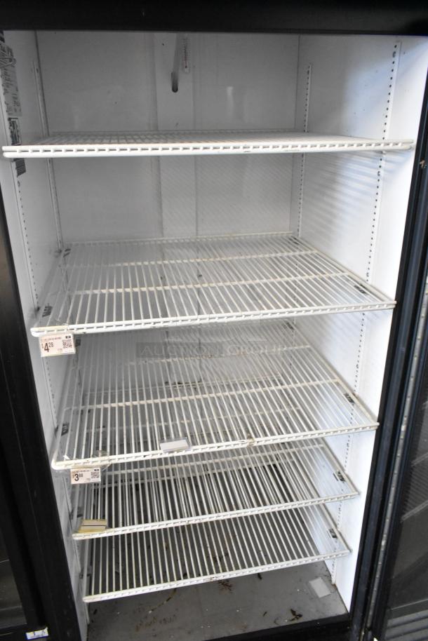 2020 True GDM-26-HC commercial cooler, metal, single door with poly-coated racks. 115 volts, 1 phase. Minimal wear visible.
