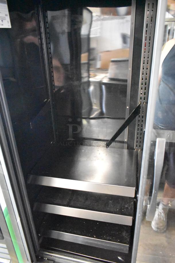 True Metal 2 Door Commercial Cooler Merchandiser with metal shelves, 115 volts, 1 phase, True brand. Interior view.