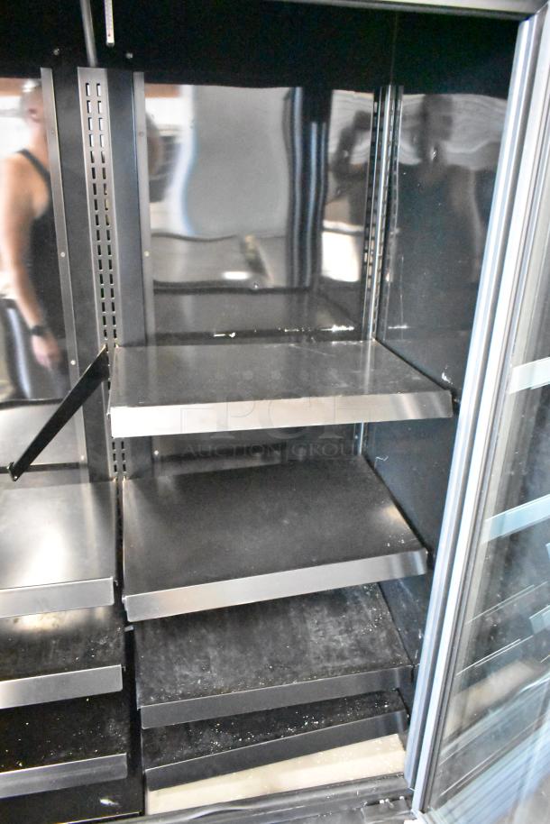 True Metal 2-Door Reach-In Cooler Merchandiser with metal shelves, clean interior, Model: 115 Volts, 1 Phase, by True.