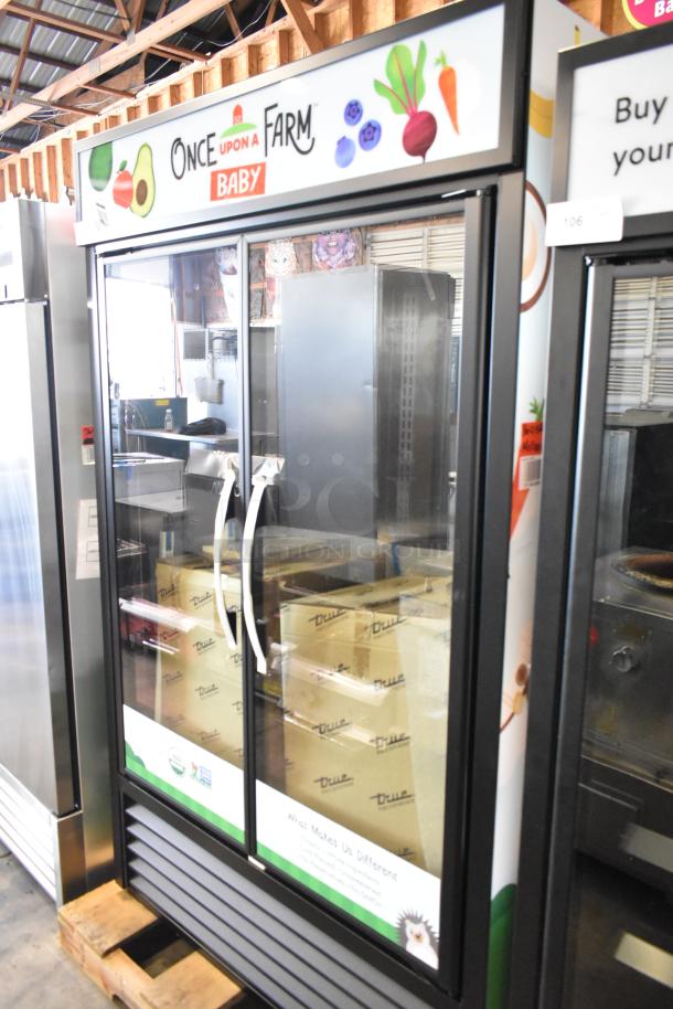 2025 True TVM-48SL-HC 2 Door Reach-In Cooler Merchandiser with metal shelves, vibrant "Once Upon a Farm" branding, 115V, 1 Phase.