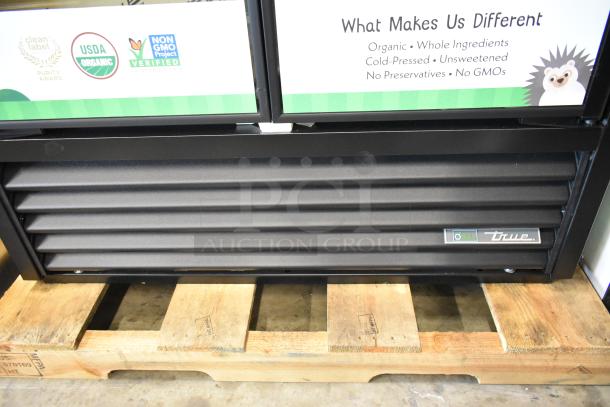 2025 True TVM-48SL-HC Metal Commercial 2 Door Reach-In Cooler on pallet, USDA organic and non-GMO label visible.