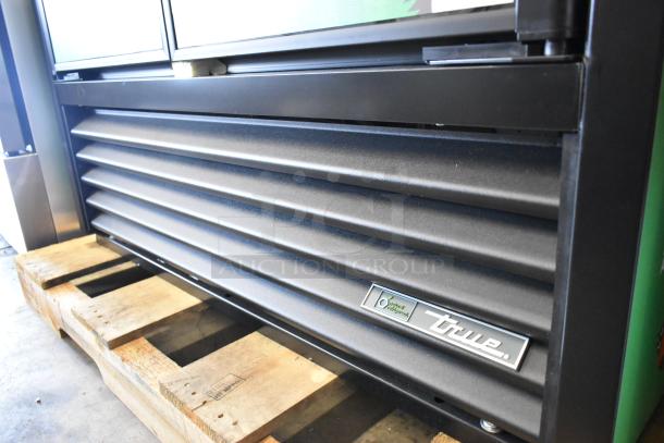 2025 True TVM-48SL-HC 2-door commercial cooler with metal shelves, visible True logo. 115 volts, 1 phase.