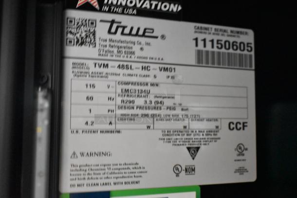 True TVM-48SL-HC metal cooler tag with specs: 115V, 1 phase, R290 refrigerant. Serial number 11150605.