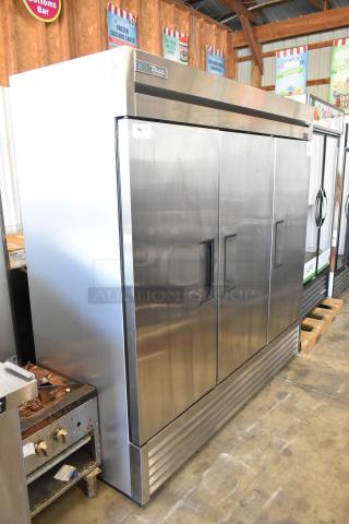 2022 True T-72-HC stainless steel 3-door reach-in cooler, excellent condition, with poly-coated racks, label indicates 115V, 1-phase.