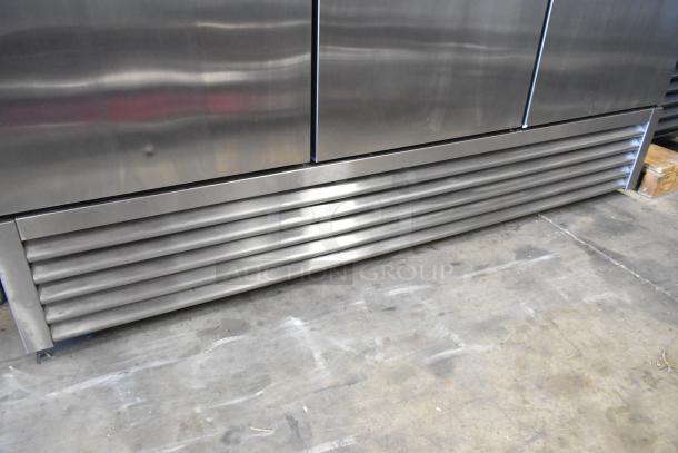 2022 True T-72-HC stainless steel commercial cooler, 3 doors, with poly coated racks, in good condition, 115V, 1 phase.