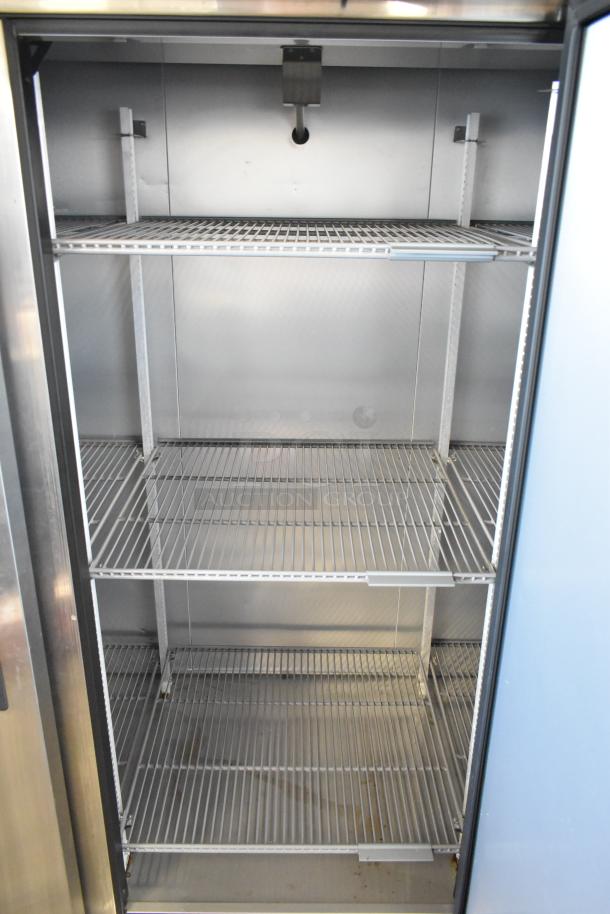 2022 True T-72-HC 3 Door Stainless Steel Cooler, poly coated racks, excellent condition, 115V, 1 phase commercial use.