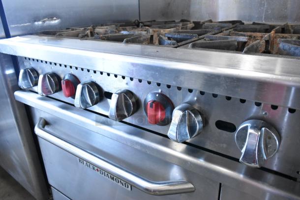 Black Diamond GR-6024G/NG stainless steel 6 burner range, right side griddle, 2 ovens, overshelf, 280,000 BTU, on casters.
